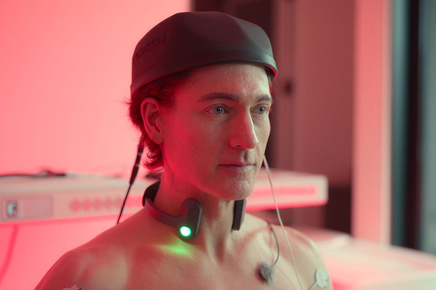 A photo of Bryan Johnson with multiple electrodes connected to him