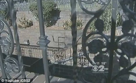 Swastika: More hateful graffiti was found on the front door of a home across the street from Haddad's mother. He is the number one suspect