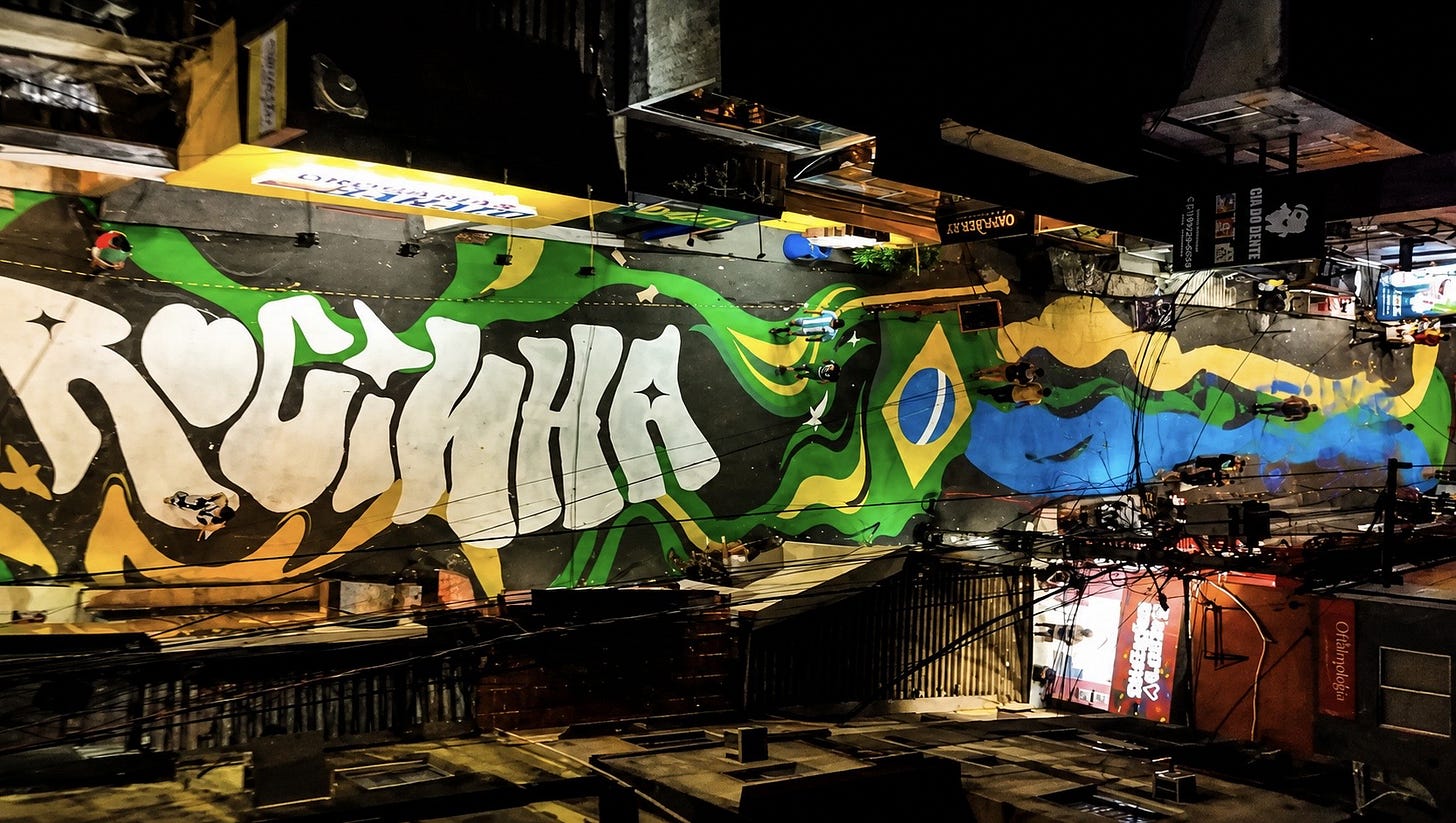 Rocinha transforma Via Ápia em maior mural da Copa 2026 e resgata tradição das ruas pintadas - Infoco Portal Rocinha transforma Via Ápia em maior mural da Copa 2026 e resgata tradição das ruas pintadas - Infoco Portal