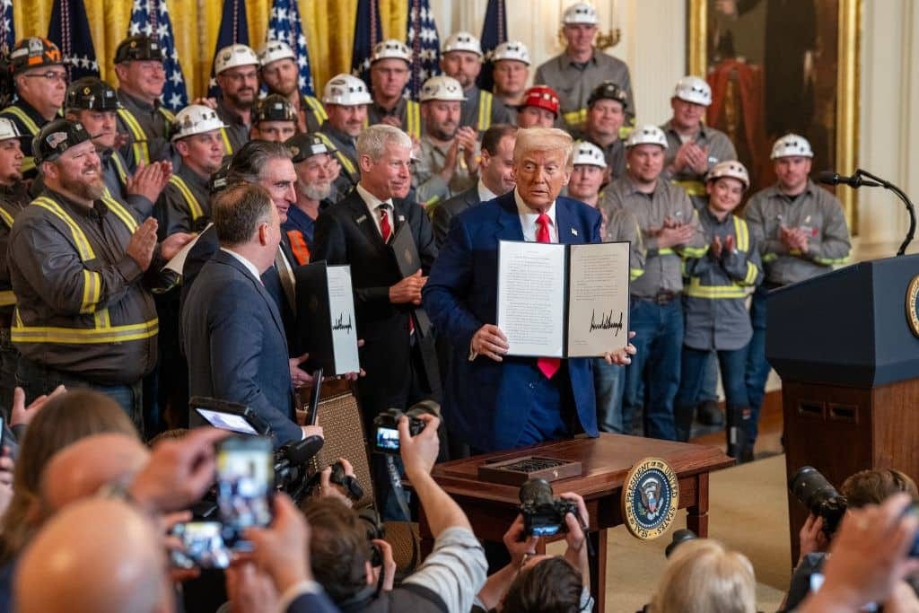 A group of coal miners clap as President Donald Trump signs executive orders on the coal industry on April 8, 2025. A group of coal miners clap as President Donald Trump signs executive orders on the coal industry on April 8, 2025.