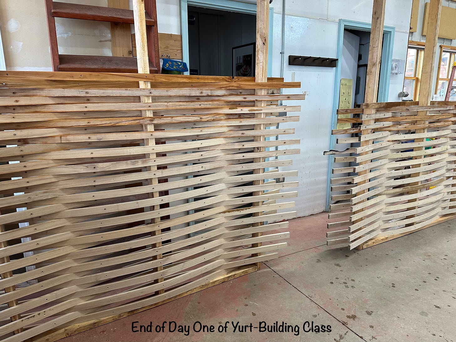 Wood slats stacked on a frame to bend them.