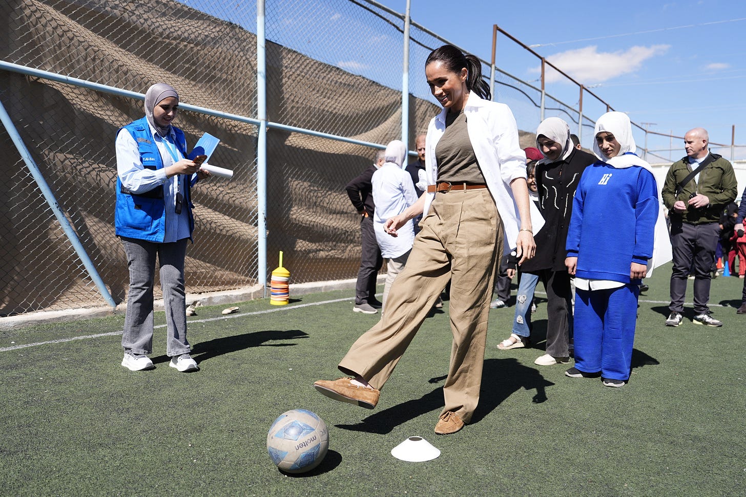 Meghan kicking a football Meghan kicking a football