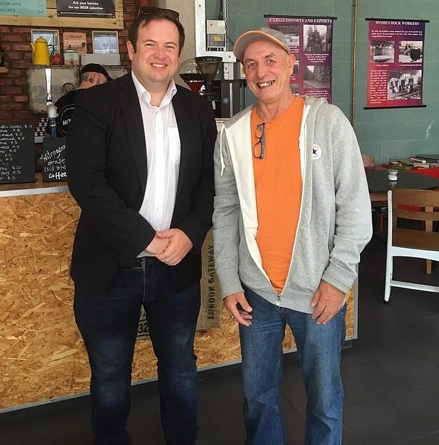 Two men standing together smiling

AI-generated content may be incorrect.