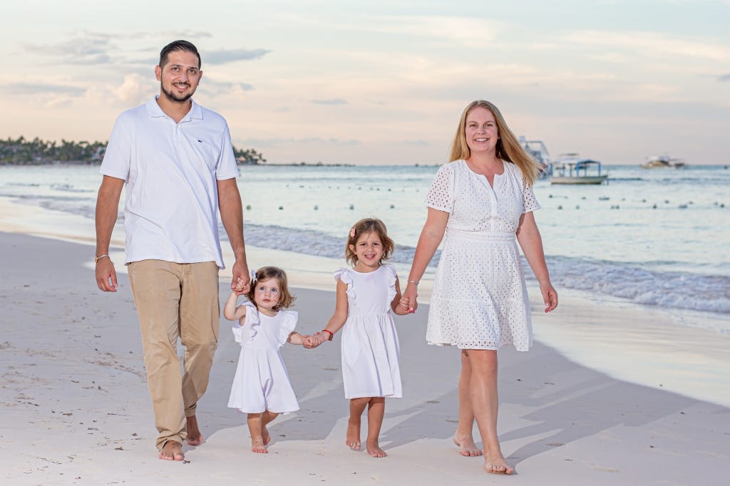 Family walking on the beautiful beach in Punta Cana, Dominican Republic