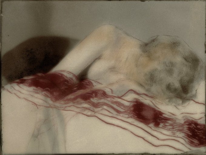 A nude human figure lies on a bed with pale skin and light hair visible in profile view from the side. The body is partially covered by red fabric with white stripes draped over the legs and lower torso exposing the back buttocks and side of the breast. The background is a plain light gray wall and bed surface in a blurred artistic style.