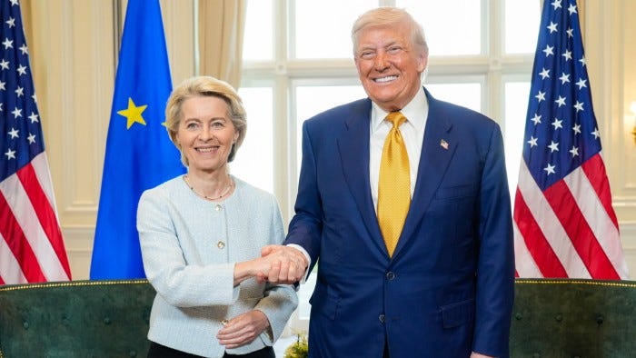 The pair are shaking hands