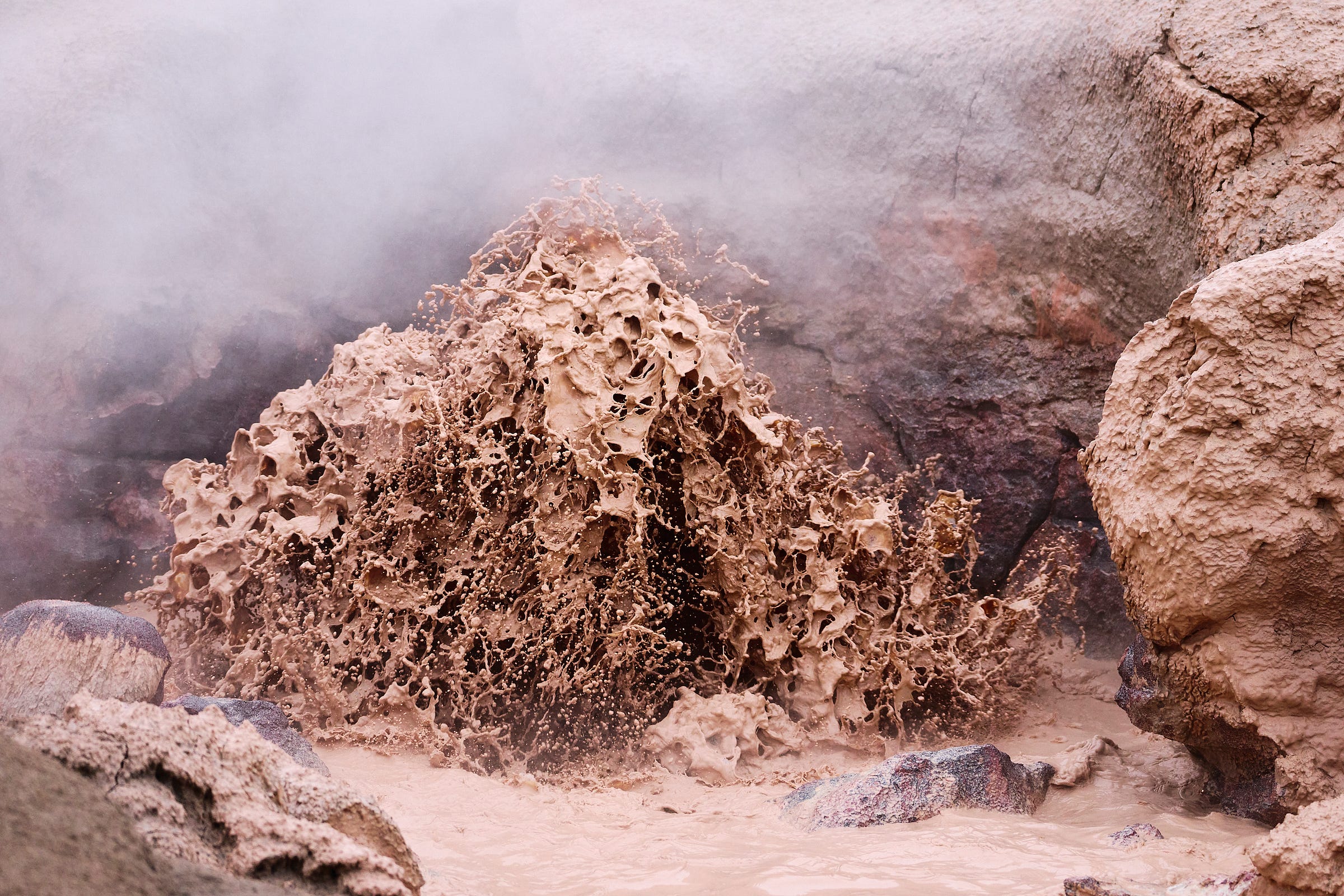 Frozen in motion, a volcanic mud pot erupts at Yellowstone National Park