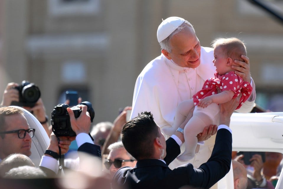 Pope Leo blesses baby & waves to crowds in St Peter's Square as world leaders gather for Pontiff's inauguration mass | The US Sun Pope Leo blesses baby & waves to crowds in St Peter's Square as world leaders gather for Pontiff's inauguration mass | The US Sun