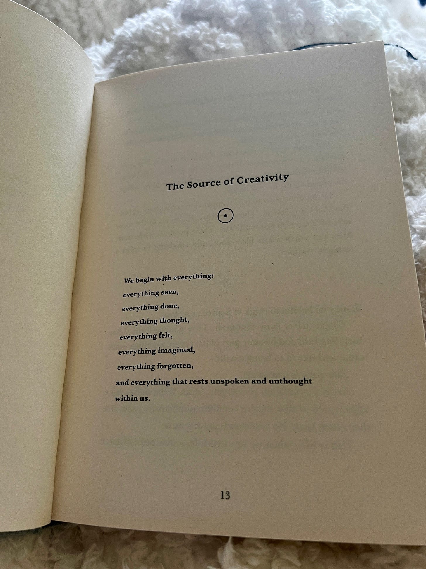 Open book showing a page titled 'The Source of Creativity' with text beginning 'We begin with everything: everything seen, everything done, everything thought, everything felt, everything imagined, everything forgotten, and everything that rests unspoken and unthought within us.