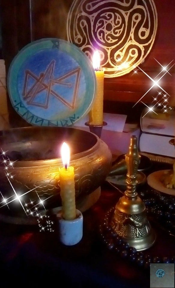 picture of part of a healing altar with a candle, thurible and sigil, at the front a brass bell picture of part of a healing altar with a candle, thurible and sigil, at the front a brass bell