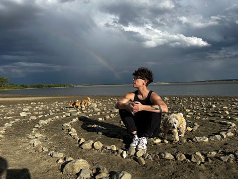 A series of photos of Andrea either posing beneath a rainbow, or wearing a sweatshirt they loved that read: "Never Stop Chasing Rainbows".