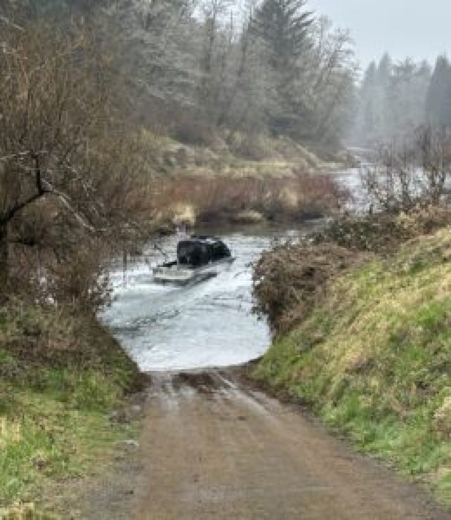 A jet boat heads down the Siletz River.