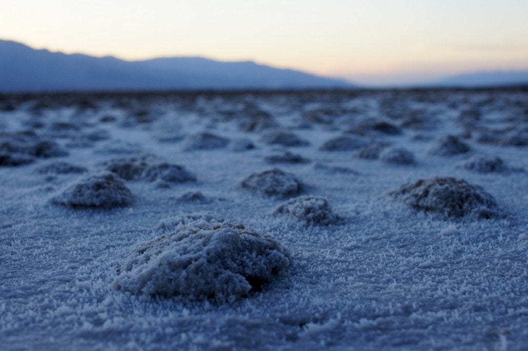 This is no place to sit and read! 100 degrees AFTER sunset in Death Valley NP at Badwater. At 282 feet below sea level, it's the lowest point in the U.S. This is no place to sit and read! 100 degrees AFTER sunset in Death Valley NP at Badwater. At 282 feet below sea level, it's the lowest point in the U.S.