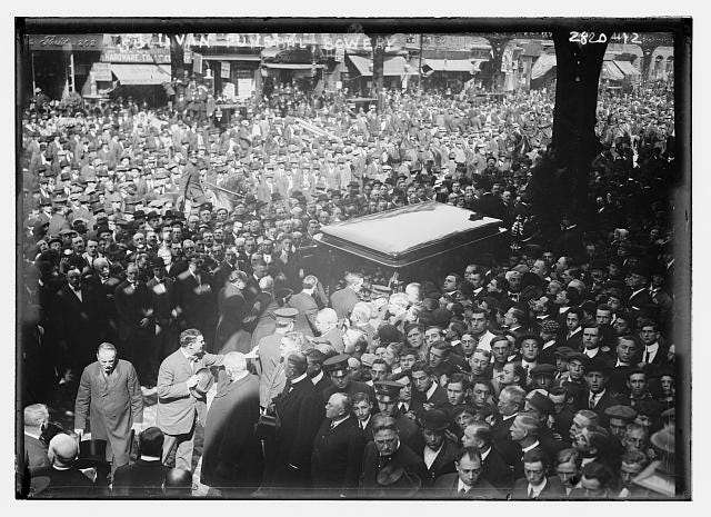 A dense crowd surrounds Big Tim Sullivan’s coffin during his 1913 funeral on the Bowery. A dense crowd surrounds Big Tim Sullivan’s coffin during his 1913 funeral on the Bowery.
