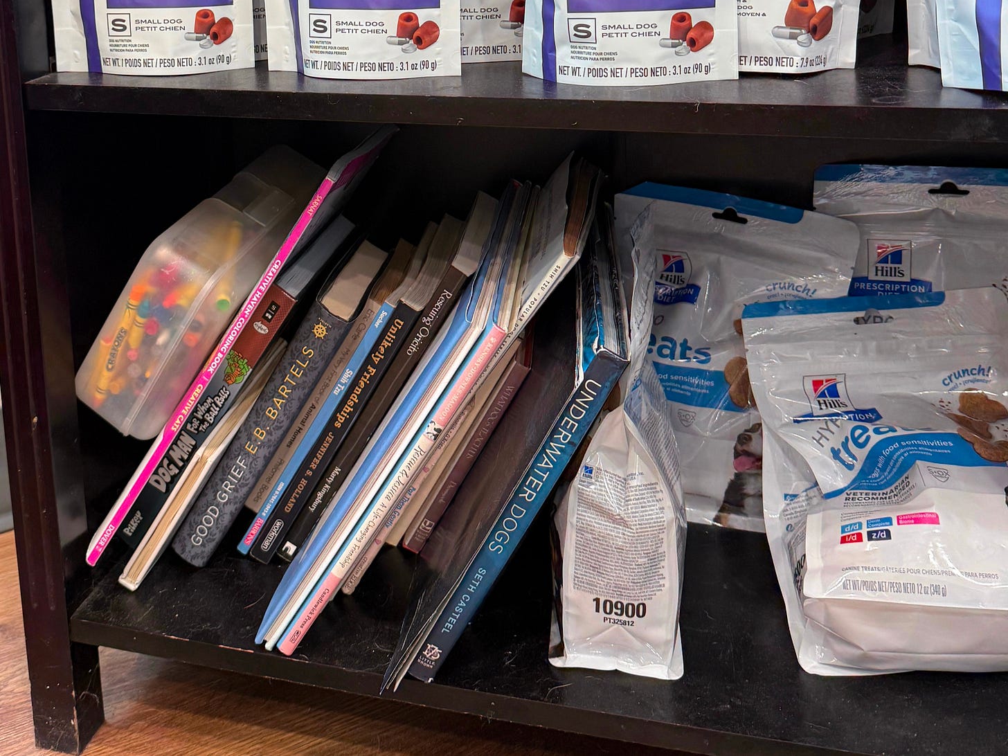 A copy of GOOD GRIEF on a crowded shelf at a vet office in Cambridge, MA