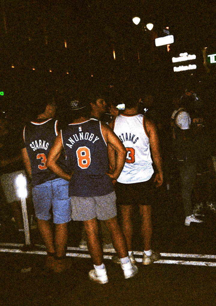 Film photos of my friend at a sushi restaurant, a brick graffitied building in Manhattan, the on-set photographer for my friend's short film, and some fans after Knicks finals game 4