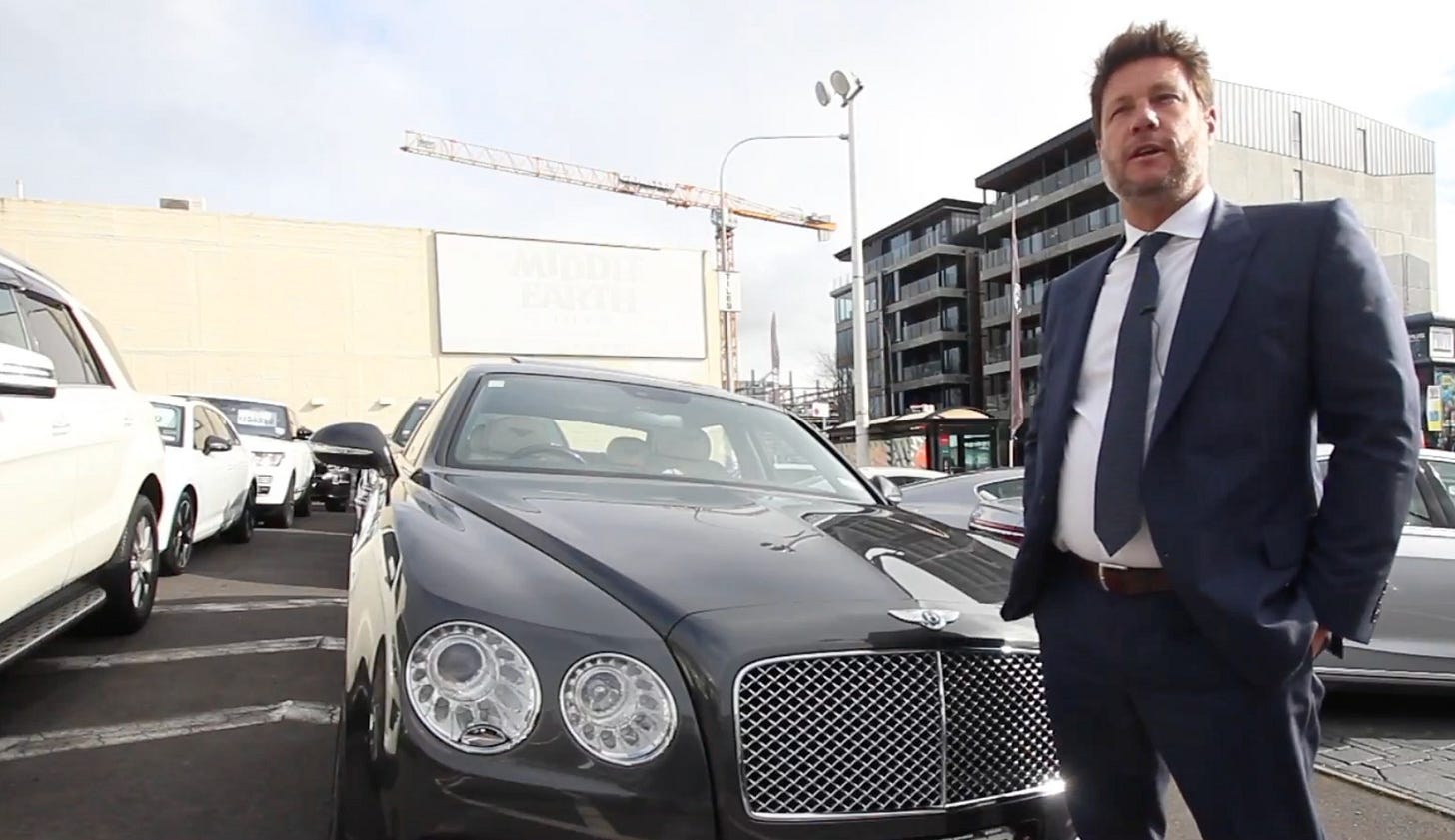 Marc Spring in a car lot. Marc Spring in a car lot.