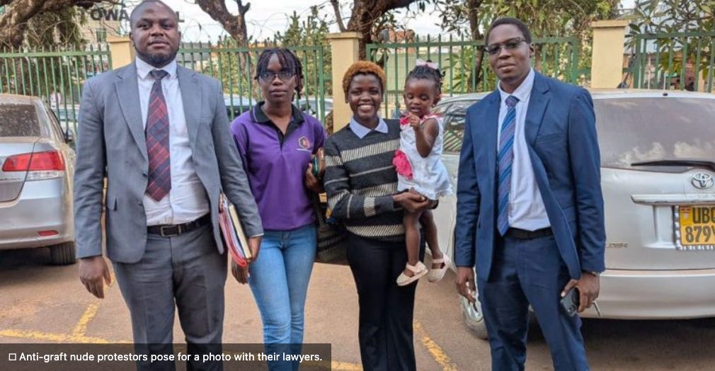 Anti-graft protestors pose for a photo with their lawyers. 