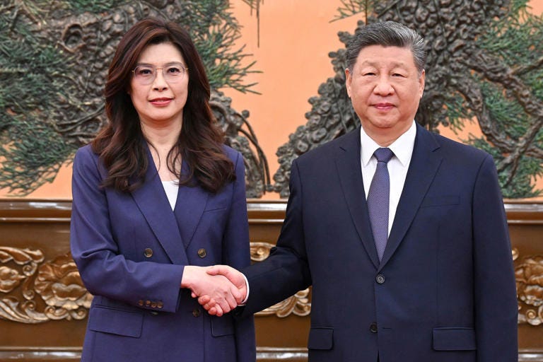 Chinese President Xi Jinping shakes hands with Taiwan’s main opposition leader, Cheng Li-wun, in Beijing on Friday. (Xie Huanchi / AP)