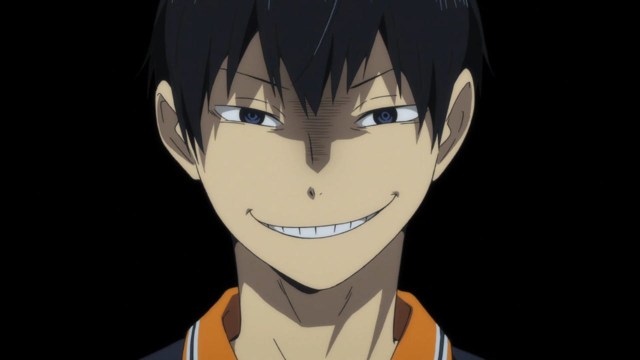 Kageyama is smiling creepily in an all black background.