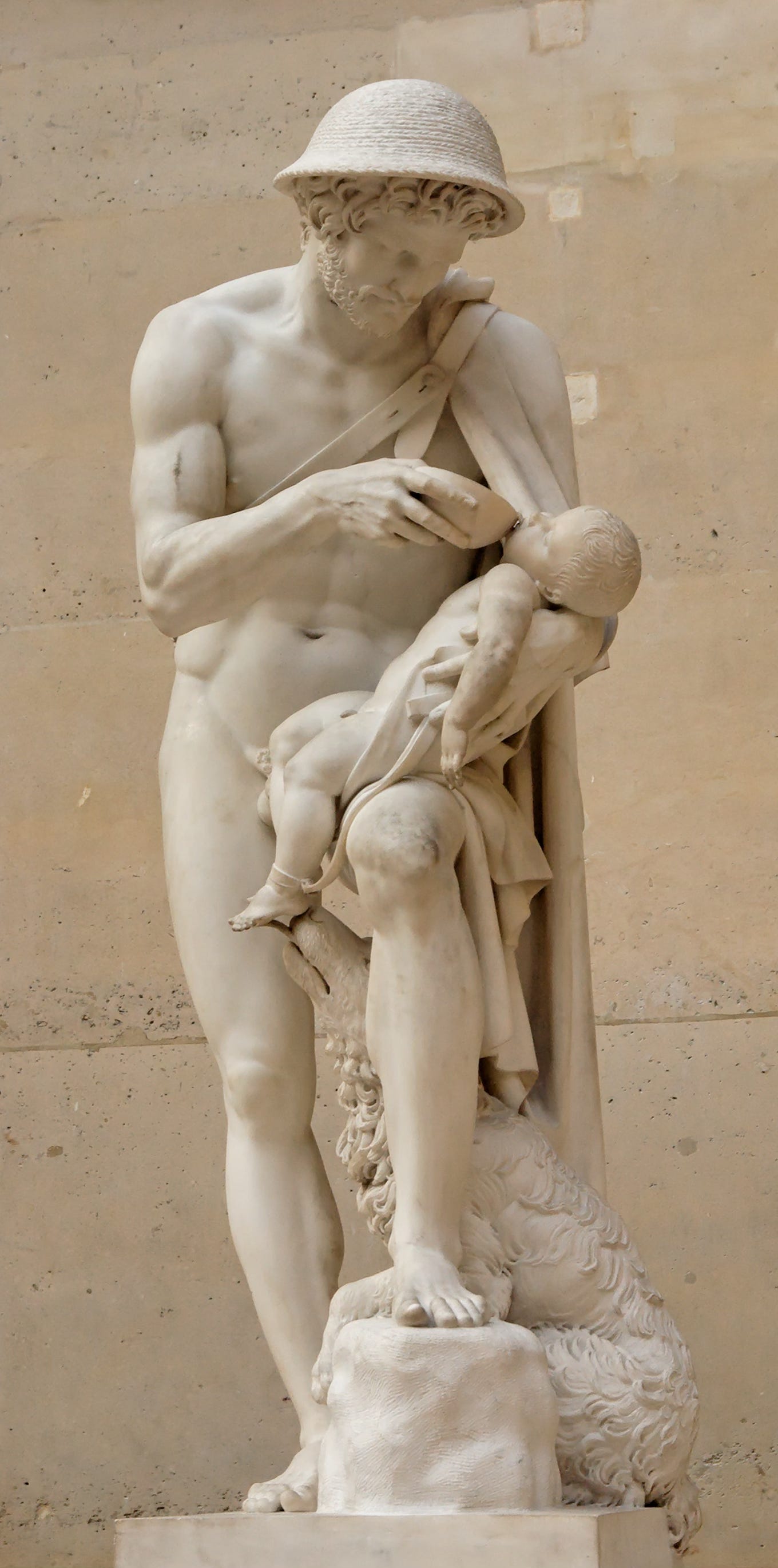 A white marble neoclassical sculpture depicting the shepherd Phorbas holding the infant Oedipus in his arms. The barefoot shepherd gazes downward at the child with concern and tenderness, while a dog at his feet gently licks the infant’s exposed foot. The baby’s small body rests across the shepherd’s forearm, emphasizing vulnerability, rescue, pity, and the fragile mercy that preserved Oedipus’s life. A white marble neoclassical sculpture depicting the shepherd Phorbas holding the infant Oedipus in his arms. The barefoot shepherd gazes downward at the child with concern and tenderness, while a dog at his feet gently licks the infant’s exposed foot. The baby’s small body rests across the shepherd’s forearm, emphasizing vulnerability, rescue, pity, and the fragile mercy that preserved Oedipus’s life.