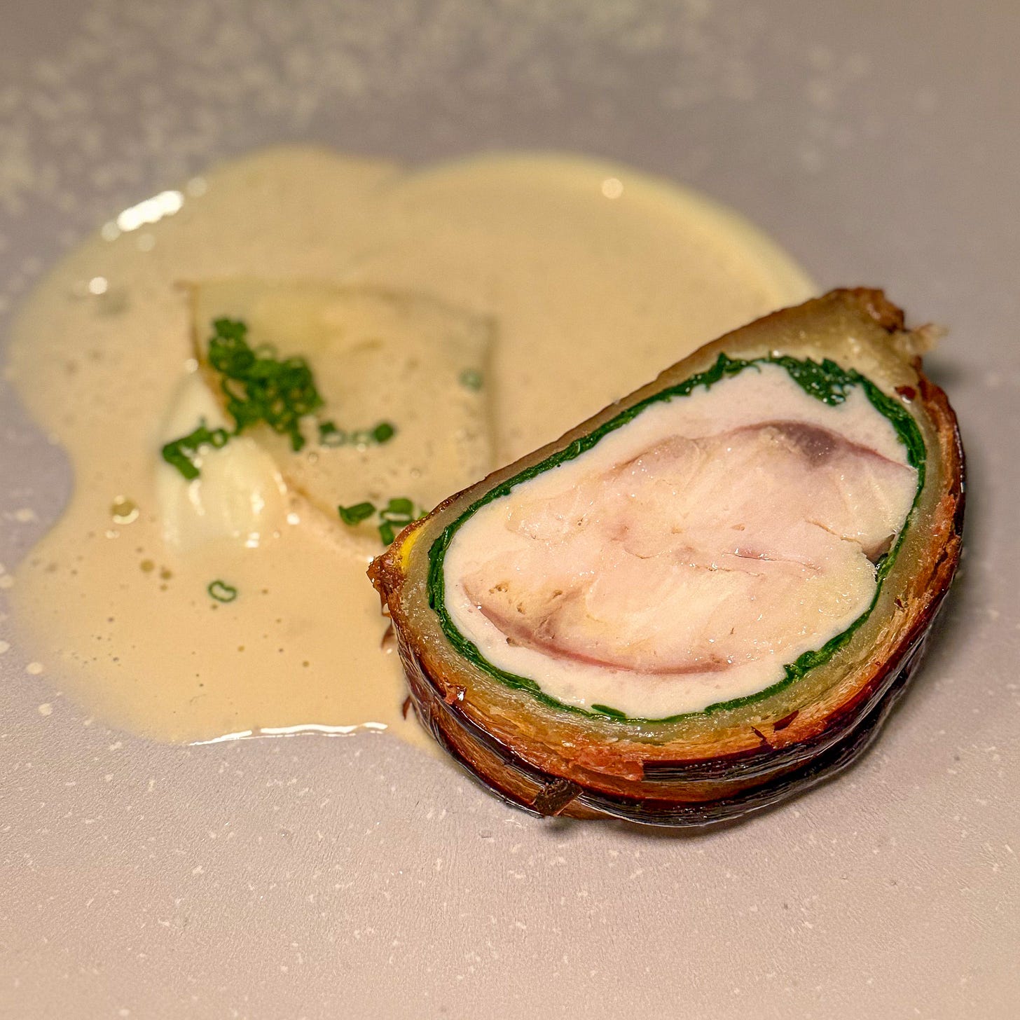 Sea bass en croûte with champagne sauce at Fugue, Paris