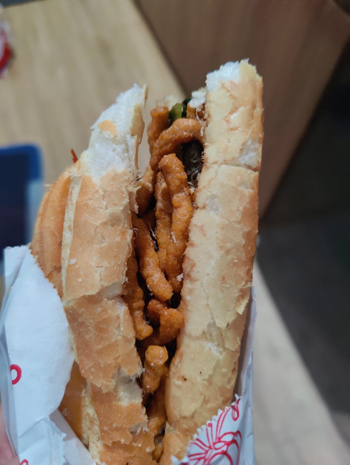 Bánh Mì Chay and downpour on the street