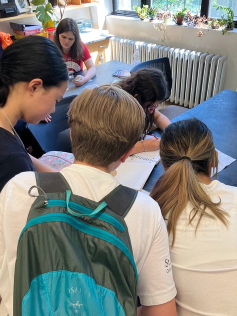 CAMPers working on the ending puzzles and games