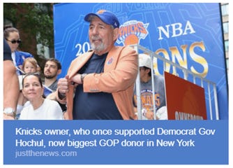 A man in an orange sweatshirt, holding a basketball, is surrounded by a crowd of people and a banner indicating his political support shift. AI-generated content may be incorrect. A man in an orange sweatshirt, holding a basketball, is surrounded by a crowd of people and a banner indicating his political support shift. AI-generated content may be incorrect.
