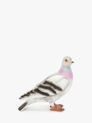 a realistic looking alert pigeon