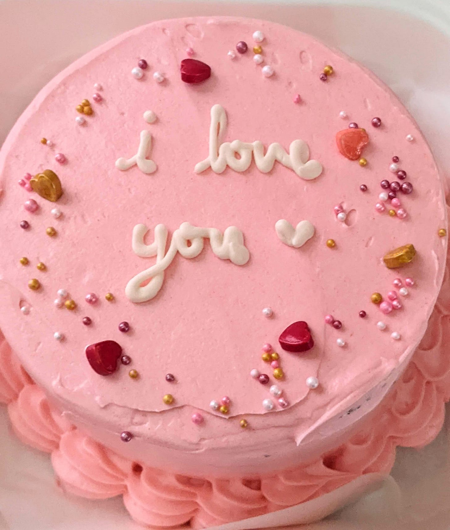 Pink, decorated cake that says "I love you" made by RoseChu
