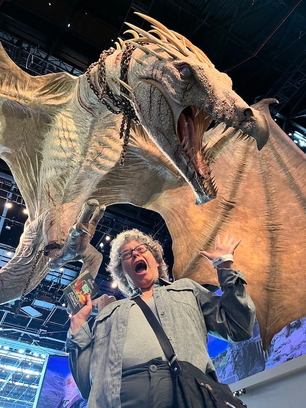 Susan enacting being snatched by a dragon at Warner Bros. Studio Tour London