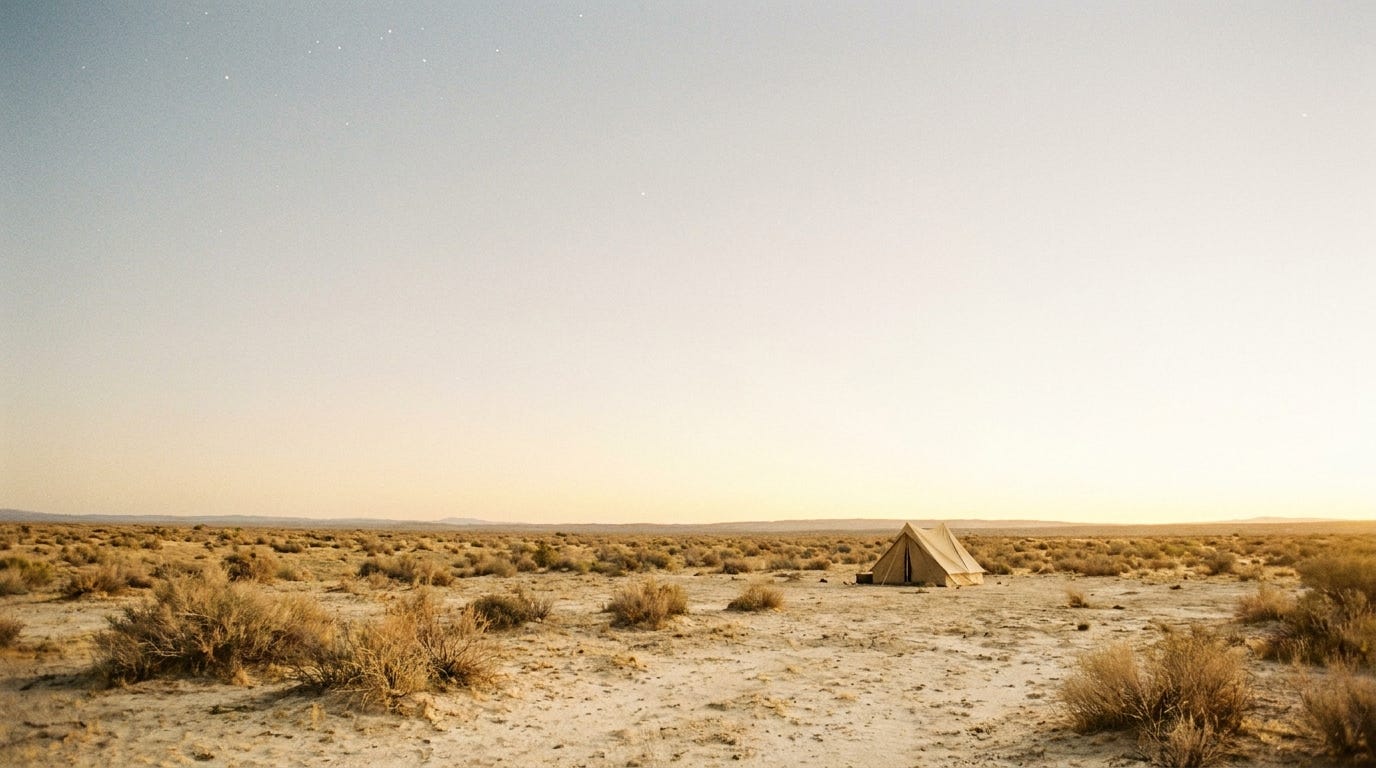 A wide desert plain at first light under an immense pale dawn sky, the last faint stars fading high above as warm golden sunrise floods the horizon, a single small tent low on the open ground, bright airy light across pale sand and scrub, no people, no faces, no text A wide desert plain at first light under an immense pale dawn sky, the last faint stars fading high above as warm golden sunrise floods the horizon, a single small tent low on the open ground, bright airy light across pale sand and scrub, no people, no faces, no text