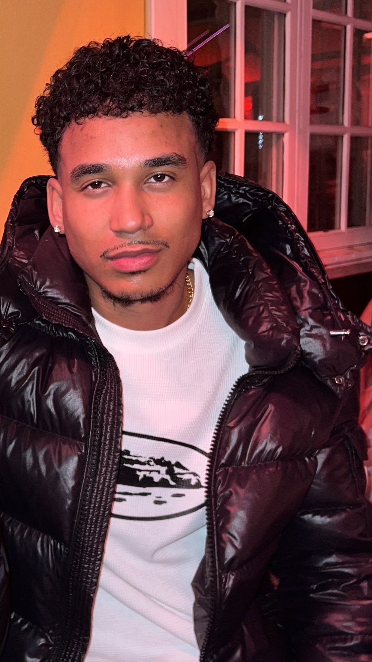 JJ in a "black shiny puffa"
