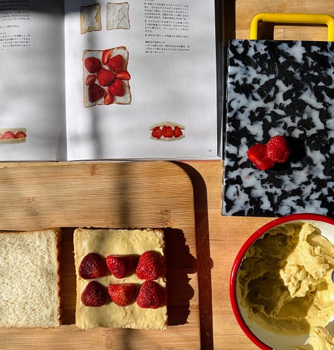 Strawberry sandwich being assembled