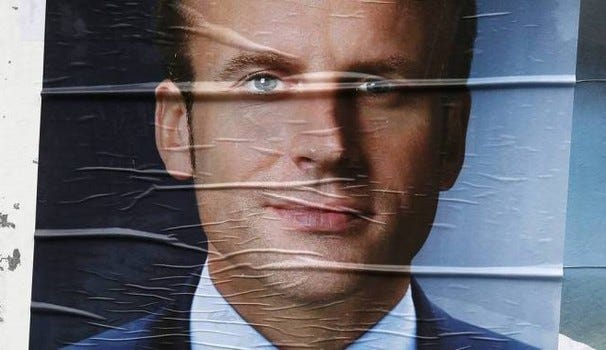 Emmanuel Macron in un manifesto della campagna elettorale. Credit: Olycom. 