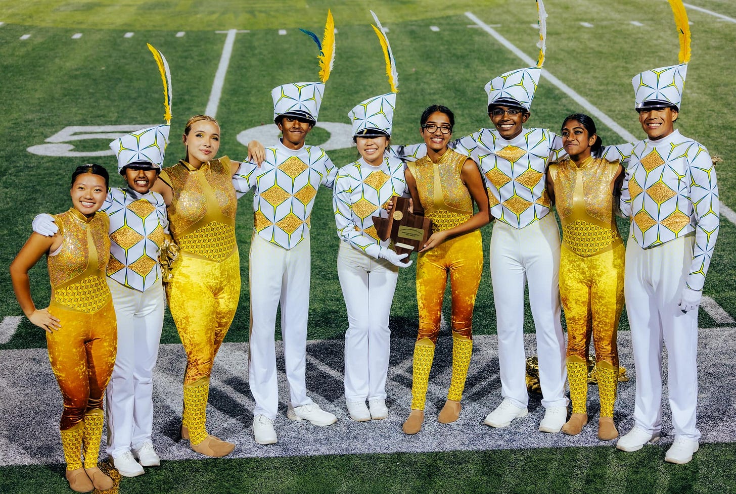 Nine proud members of the Coppell High School varsity marching band