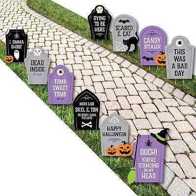 Halloween tombstone decorations with cheesy phrases on each.