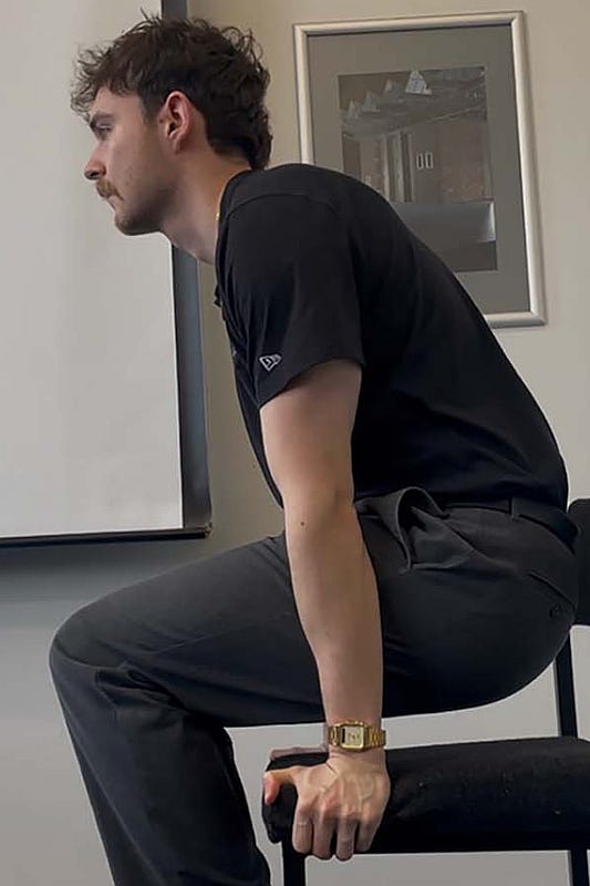 A person performing a chair pushup