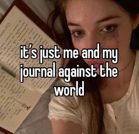 This may contain: a woman laying in bed next to an open book with the caption it's just me and my journal against the world
