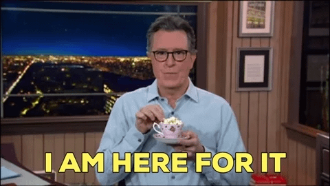 A man eats popcorn and says I am here for it A man eats popcorn and says I am here for it