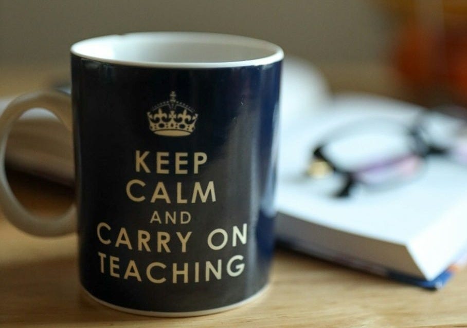 blue and white ceramic mug on brown wooden table