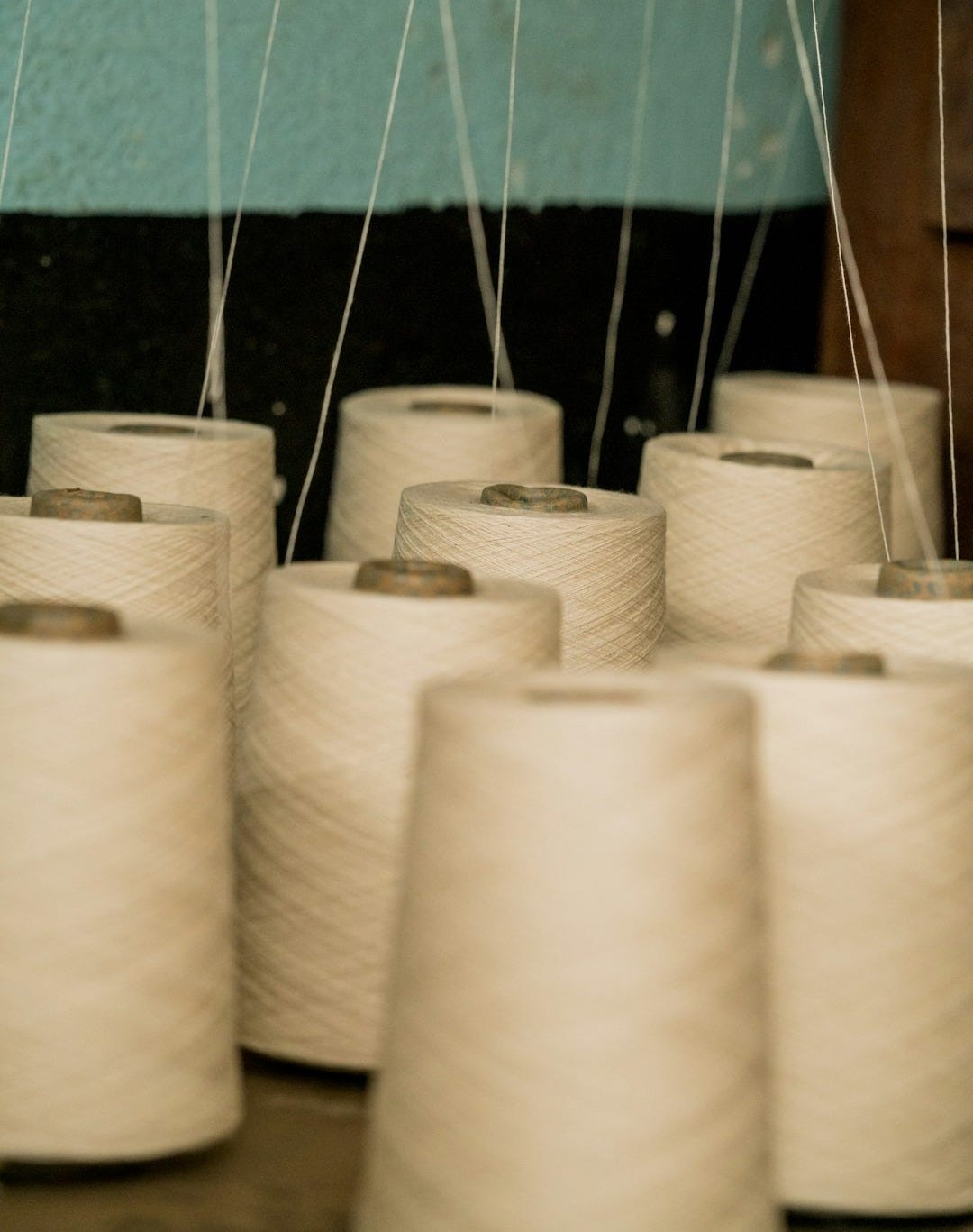 selective focus photography of white threads