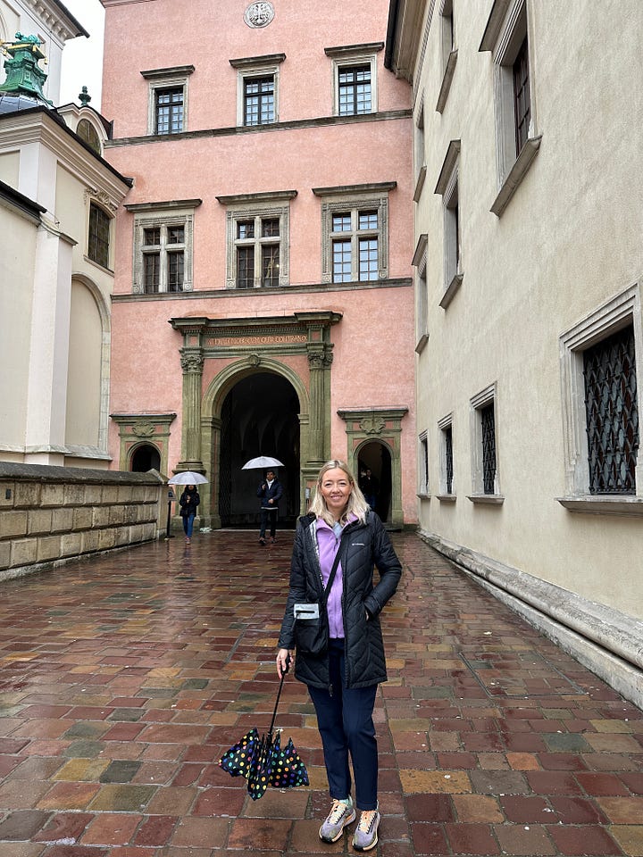 Author in front of historical buildings and doors