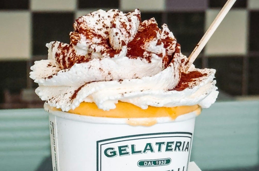 Dessert with whipped cream and cocoa powder