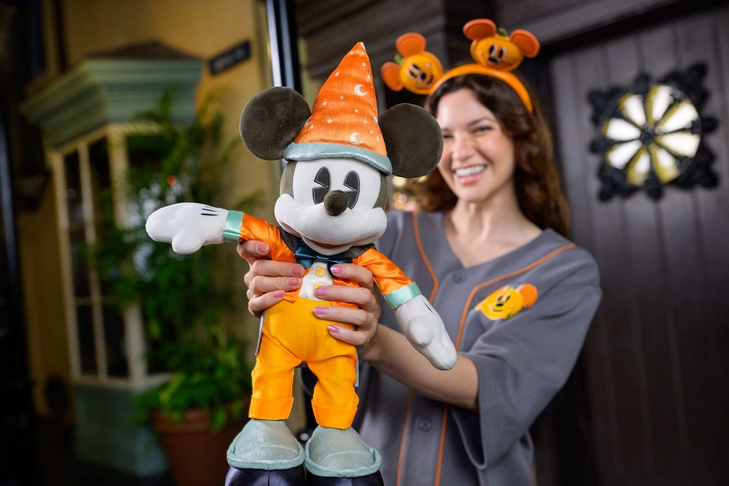 Woman holding Mickey Mouse Halloween Plush Woman holding Mickey Mouse Halloween Plush
