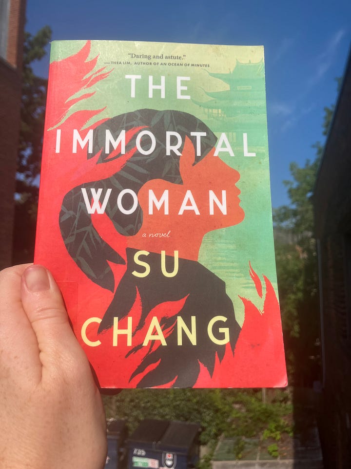 6 different images, books lying on a table or being held up by my hand: Audition by Katie Kitamura, Lion by Sonya Walger, The Rooftop Garden by Menaka Raman-Wilms, A Convergence of Solitudes by Anita Anand, The Immortal Woman by Su Chang, and The Parisian by Isabella Hammad