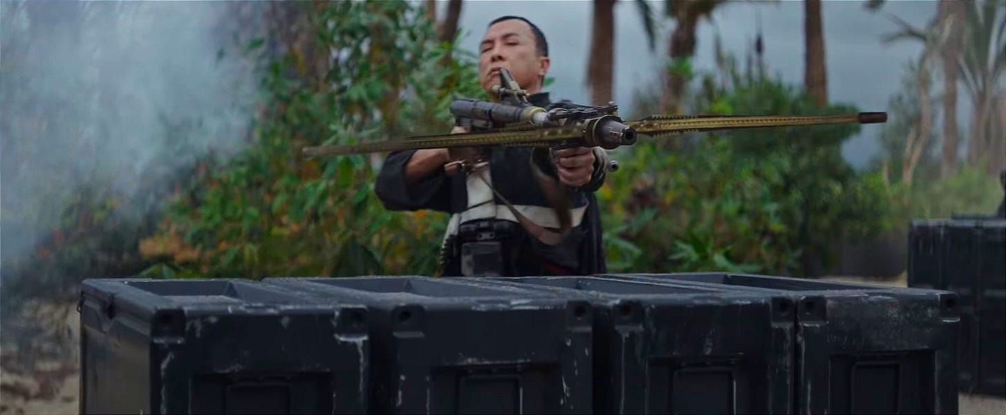 Chirrut Imwe firing a blaster in Rogue One: A Star Wars Story