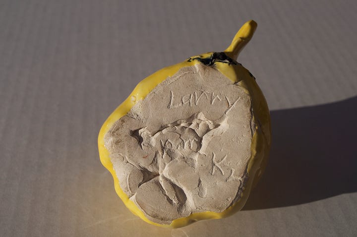 squash head, clay, sculpture, yellow face