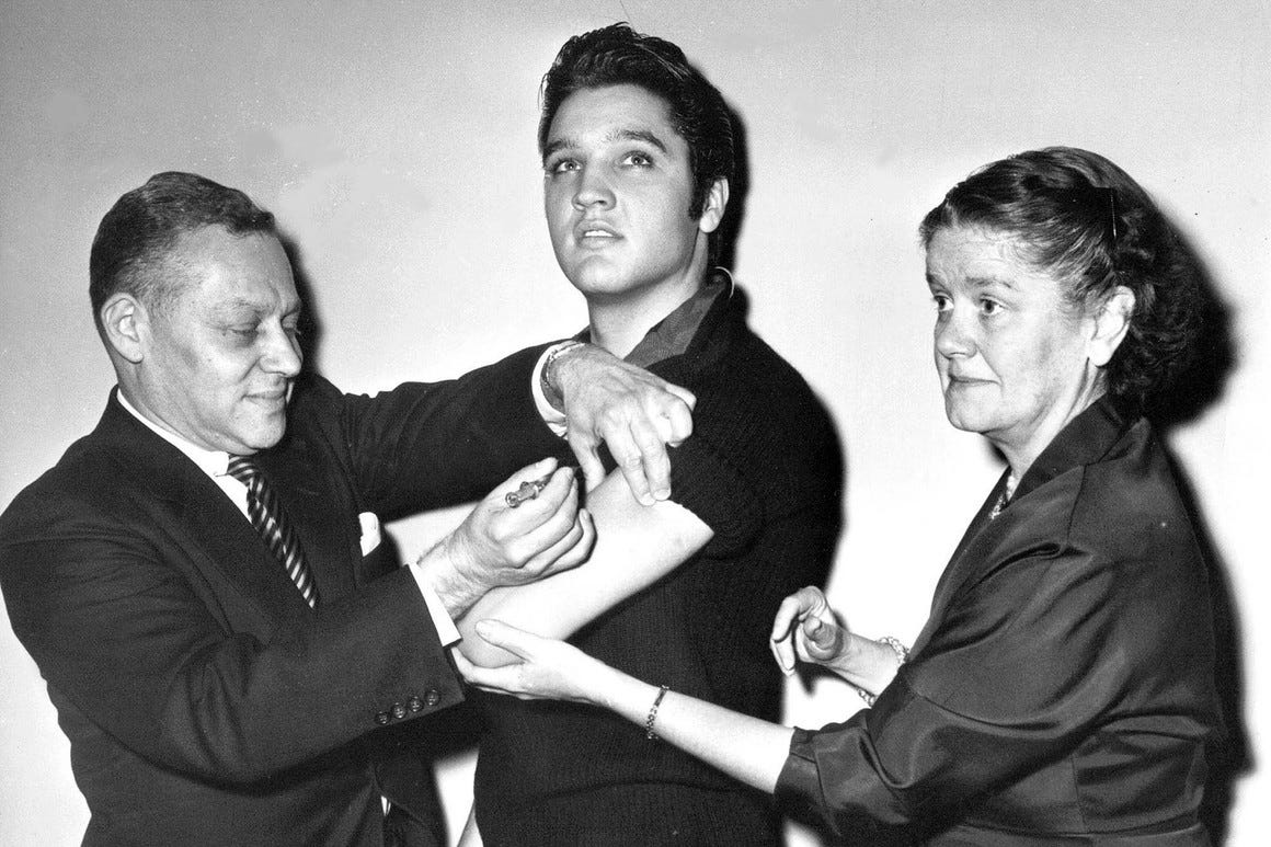In this Oct. 28, 1956 file photo, Elvis Presley receives a Salk polio vaccine shot in New York City (AP Photo/File)